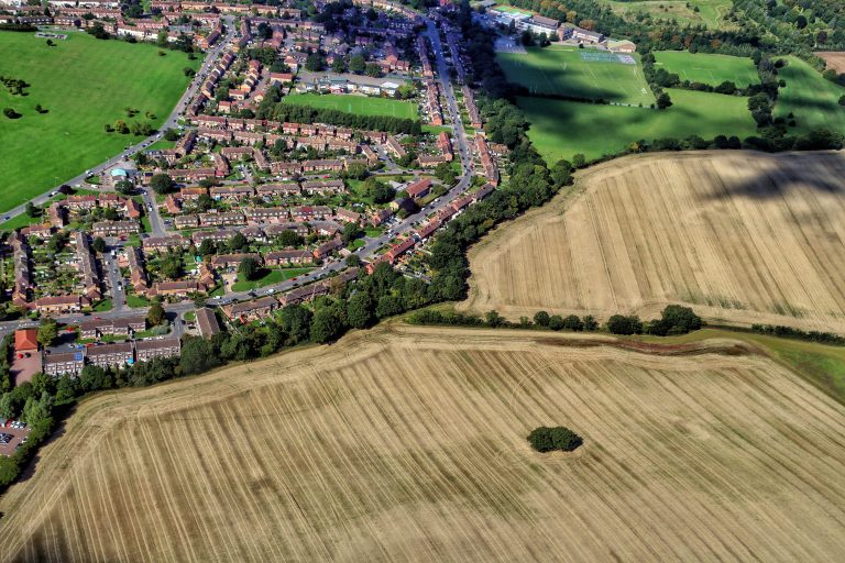 aerial-view-residential-district-by-field